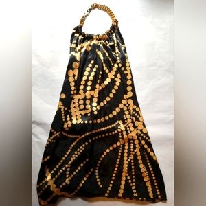 Black and gold chain around neck half back blouse